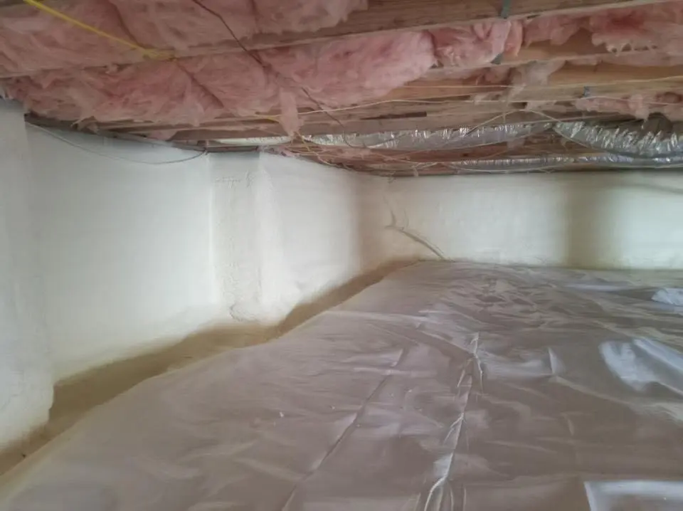 Crawl space encapsulation with closed-cell spray foam for Commercial Roof Restoration in Elkins